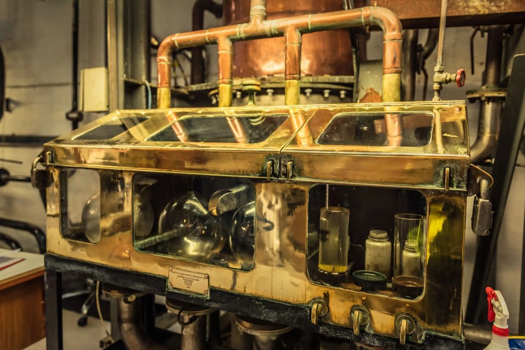 Old copper machinery which is part of the historic whiskey distillation process at Loch Lemon whiskey.