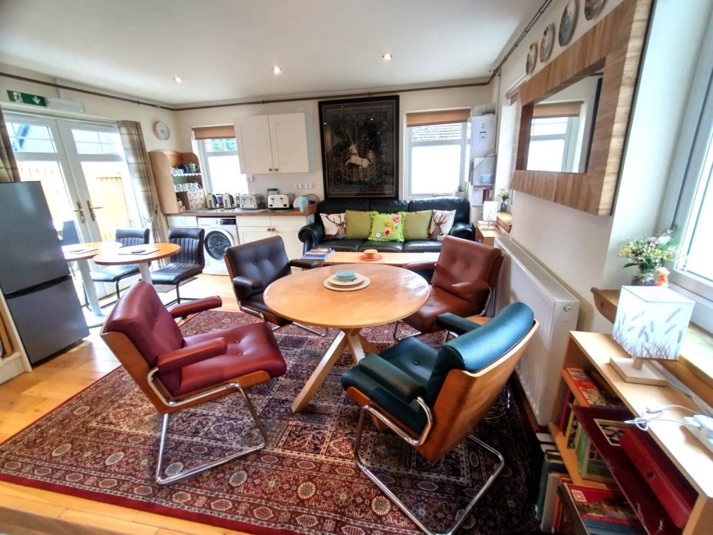A living room and kitchen space in Balmaha Bunkhouse.