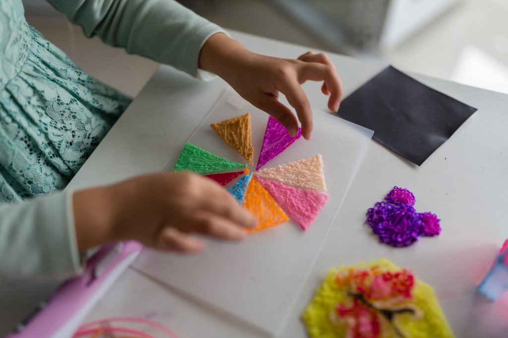 a child doing arts and crafts.