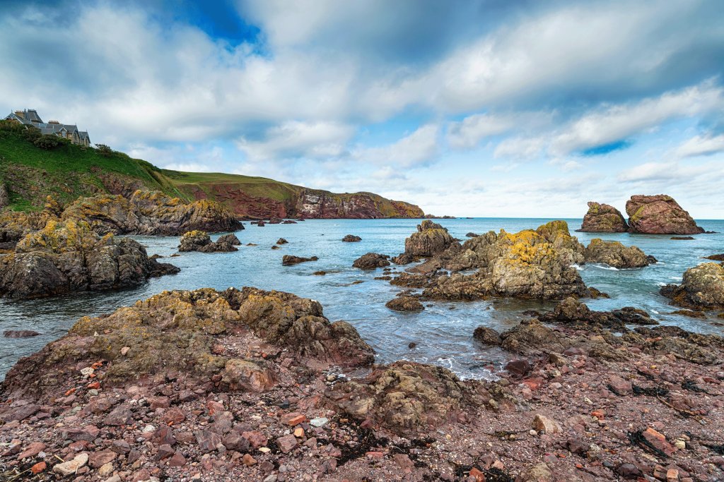 A view of the ocean and rocks along the Scottish Borders.